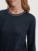 Women model is wearing Pyjama with cuff made of 100% Cotton in Blue, Patterned from the Winter Dreams series by CALIDA, Detail