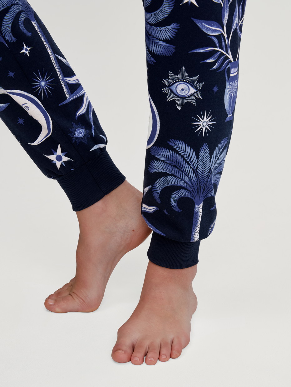 Women model is wearing Pyjama with cuff made of 100% Cotton in Blue, Patterned from the Winter Dreams series by CALIDA, Detail