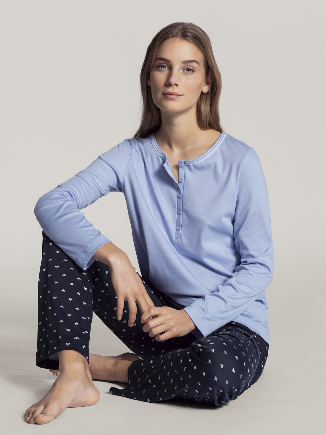 Women model is wearing Pyjama made of 100% Cotton in Blue, Motif from the Night Lovers series by CALIDA, Front view