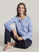 Women model is wearing Pyjama made of 100% Cotton in Blue, Motif from the Night Lovers series by CALIDA, Front view