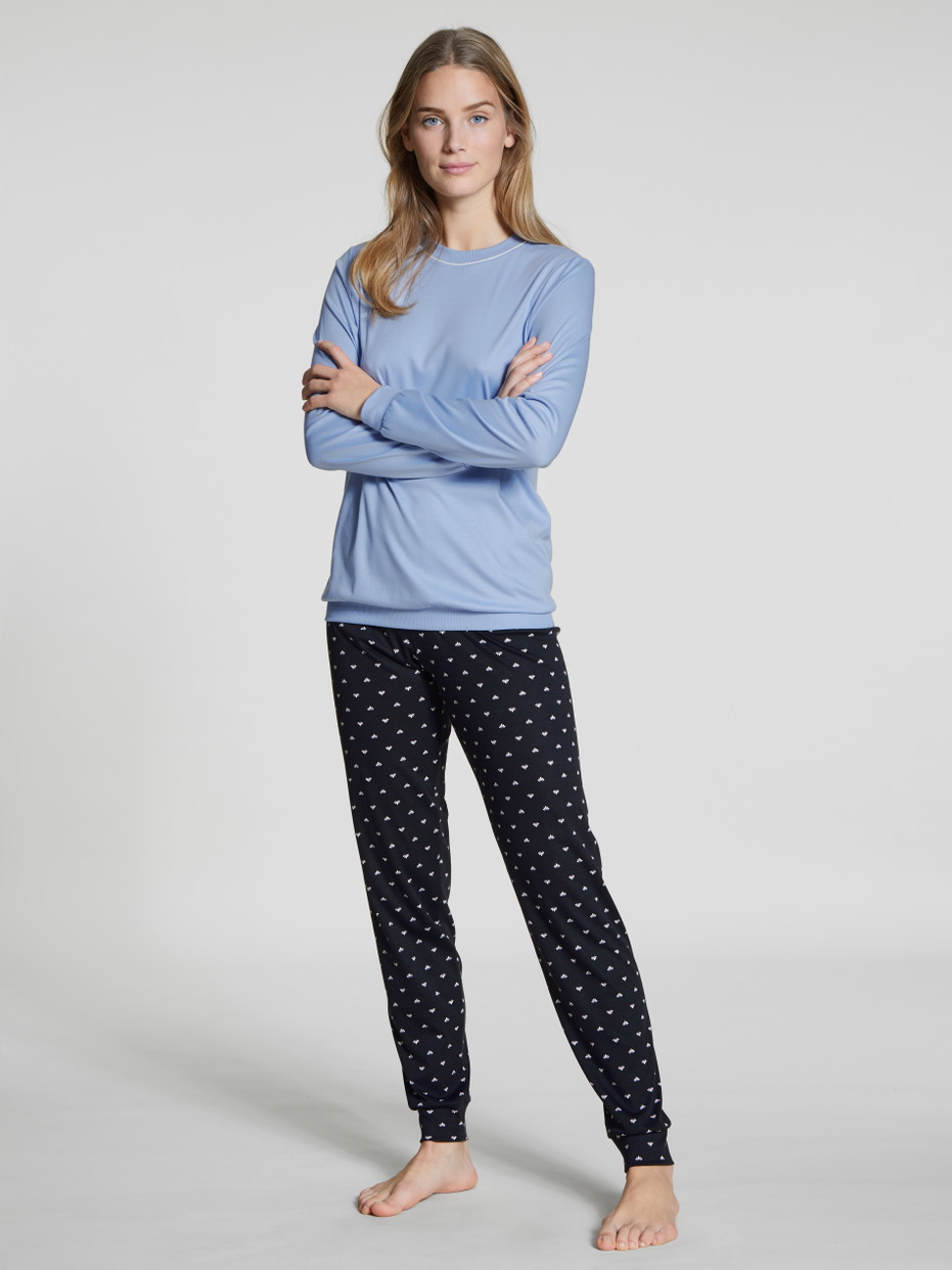 Women model is wearing Pyjama with cuff made of 100% Cotton in Blue, Motif from the Night Lovers series by CALIDA, Front view