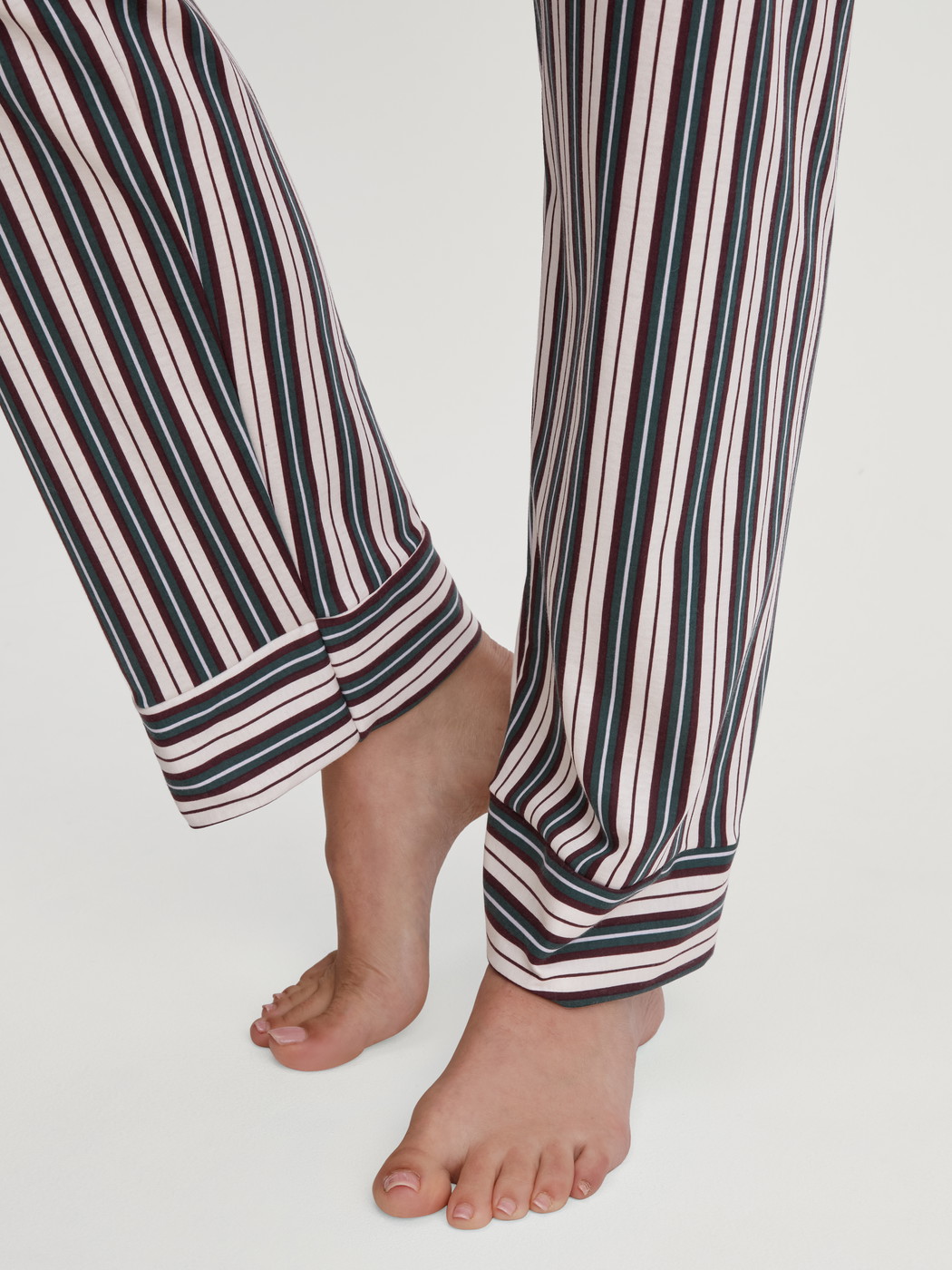 Women model is wearing Button-Up Pyjama made of 100% Cotton in Green, Striped from the Night Lovers series by CALIDA, Detail