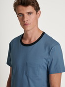 Men model is wearing Short pyjama made of 100% Cotton in Blue, Unicoloured from the Relax Essentials series by CALIDA, Detail