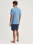 Men model is wearing Short pyjamas made of 100% Cotton in Blue, Patterned from the Relax Swiss Resort series by CALIDA, Back view