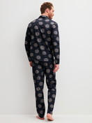 Men model is wearing Button-Up Pyjama made of 100% Cotton in Blue, Patterned from the EDITION 85 series by CALIDA, Back view