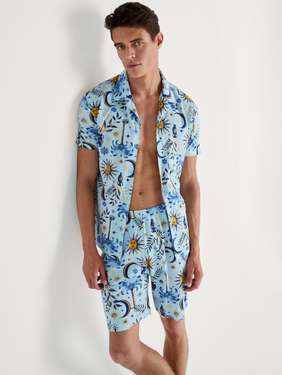 Men model is wearing Short Pyjamas with Buttons made of 100% Cotton in Turquoise, Patterned from the Relax Magic series by CALIDA, Front view