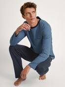 Men model is wearing Pyjama made of 100% Cotton in Blue, Unicoloured from the Relax Essentials series by CALIDA, Front view