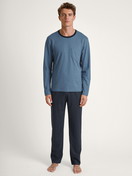 Men model is wearing Pyjama made of 100% Cotton in Blue, Unicoloured from the Relax Essentials series by CALIDA, Front view