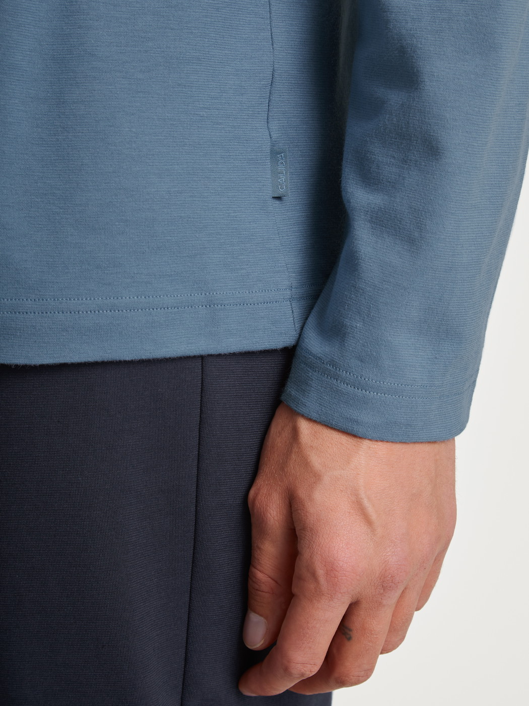Men model is wearing Pyjama made of 100% Cotton in Blue, Unicoloured from the Relax Essentials series by CALIDA, Detail