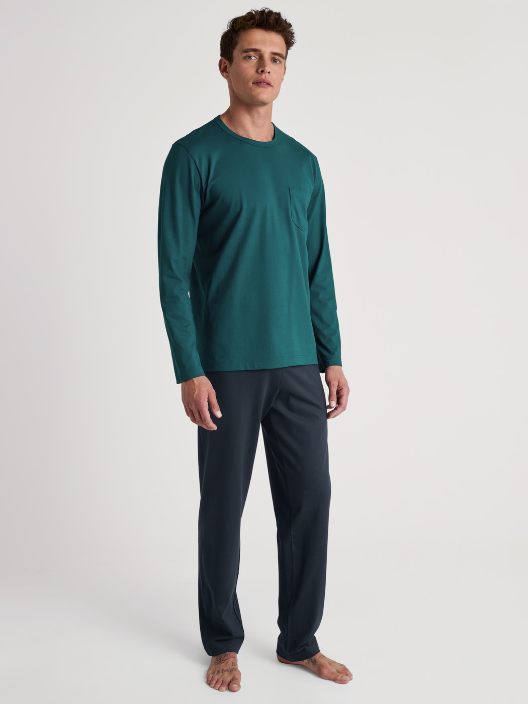 Men model is wearing Pyjama made of 100% Cotton in Turquoise, Unicoloured from the Relax Essentials series by CALIDA, Front view