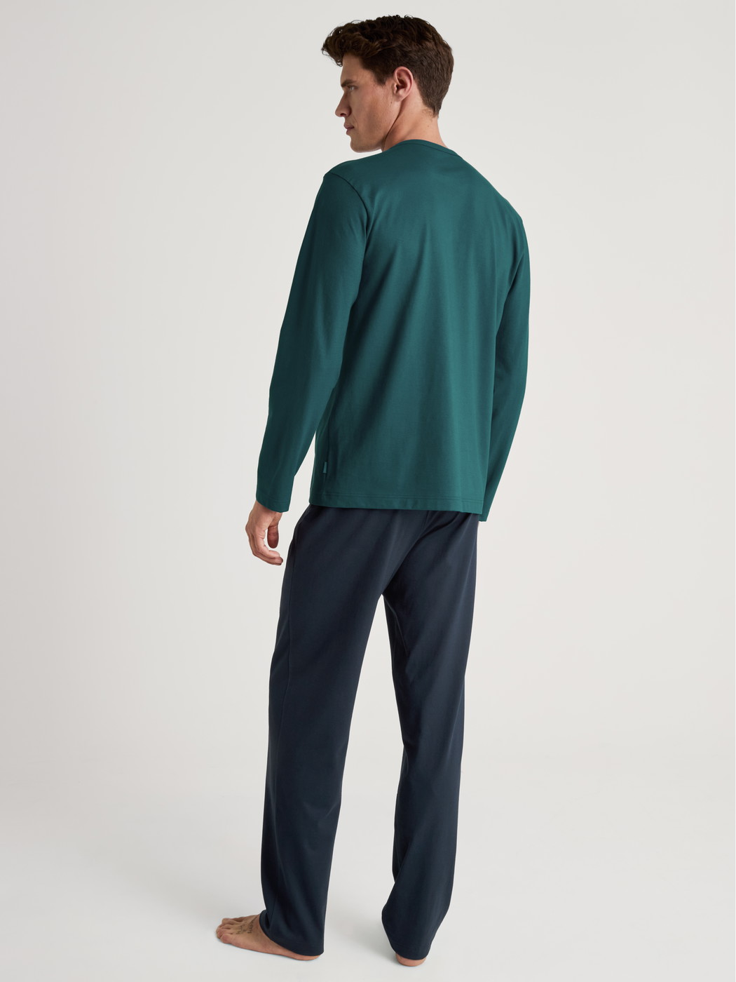 Men model is wearing Pyjama made of 100% Cotton in Turquoise, Unicoloured from the Relax Essentials series by CALIDA, Back view
