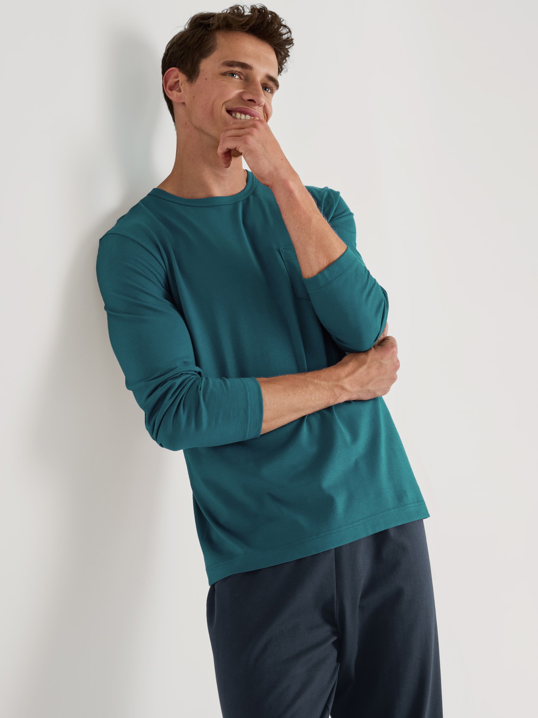 Men model is wearing Pyjama made of 100% Cotton in Turquoise, Unicoloured from the Relax Essentials series by CALIDA, Outfit