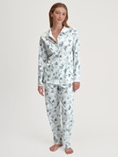 Women model is wearing Button-Up Pyjama made of 100% Cotton in Blue, Patterned from the Swiss Resort series by CALIDA, Front view