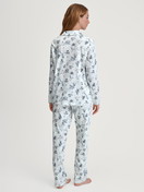 Women model is wearing Button-Up Pyjama made of 100% Cotton in Blue, Patterned from the Swiss Resort series by CALIDA, Back view
