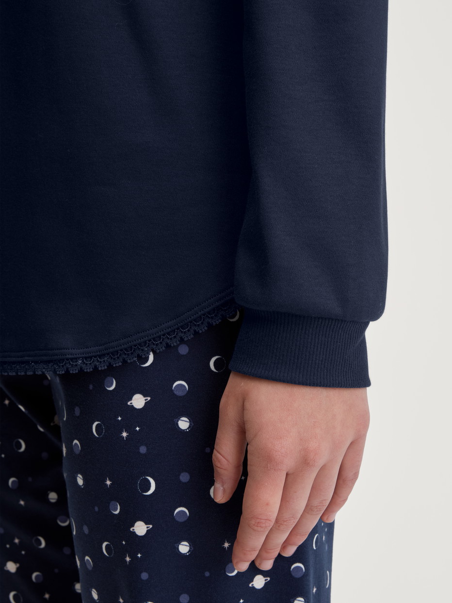 Women model is wearing Pyjama with cuff made of 100% Cotton in Blue, Patterned from the Midnight Dreams series by CALIDA, Detail