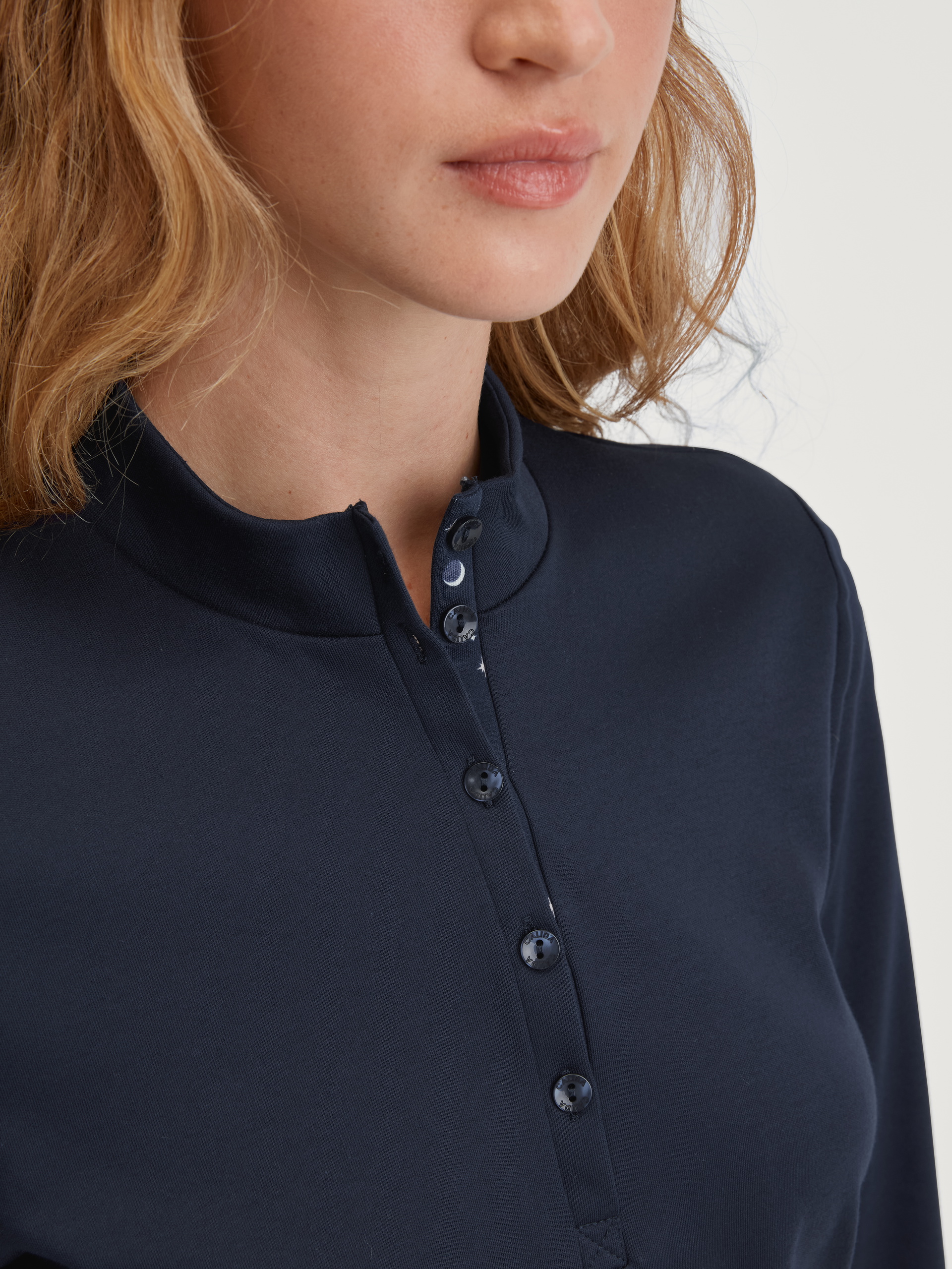 Women model is wearing Pyjama with cuff made of 100% Cotton in Blue, Patterned from the Midnight Dreams series by CALIDA, Detail