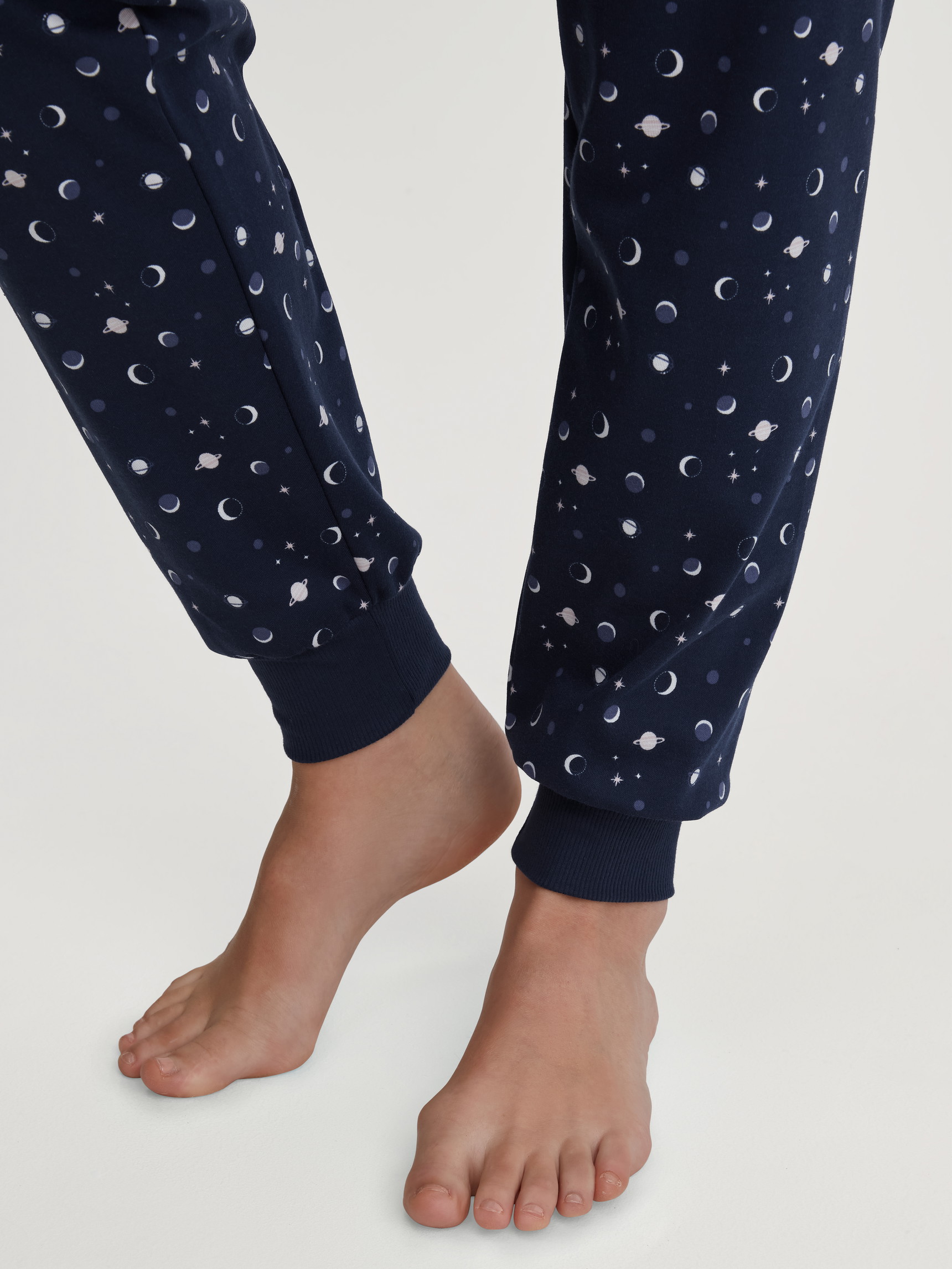 Women model is wearing Pyjama with cuff made of 100% Cotton in Blue, Patterned from the Midnight Dreams series by CALIDA, Detail