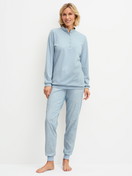 Women model is wearing Ribbed Cuff Pyjamas made of 100% Cotton in Blue, Patterned from the Midnight Dreams series by CALIDA, Front view