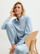 Women model is wearing Ribbed Cuff Pyjamas made of 100% Cotton in Blue, Patterned from the Midnight Dreams series by CALIDA, Additional Image
