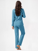 Women model is wearing Button-Up Pyjama made of 100% Cotton in Blue, Unicoloured from the Nightwear Xtra series by CALIDA, Back view