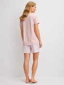Women model is wearing Short pyjamas made of 100% Cotton in Pink, Floral from the Cotton Special series by CALIDA, Back view