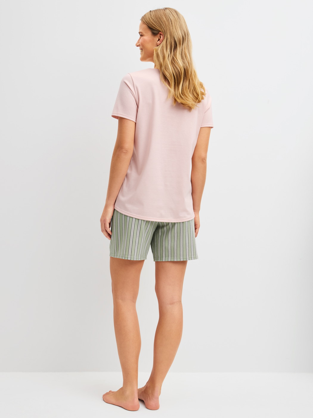 Women model is wearing Short pyjamas made of 100% Cotton in Green, Striped from the Cotton Special series by CALIDA, Back view