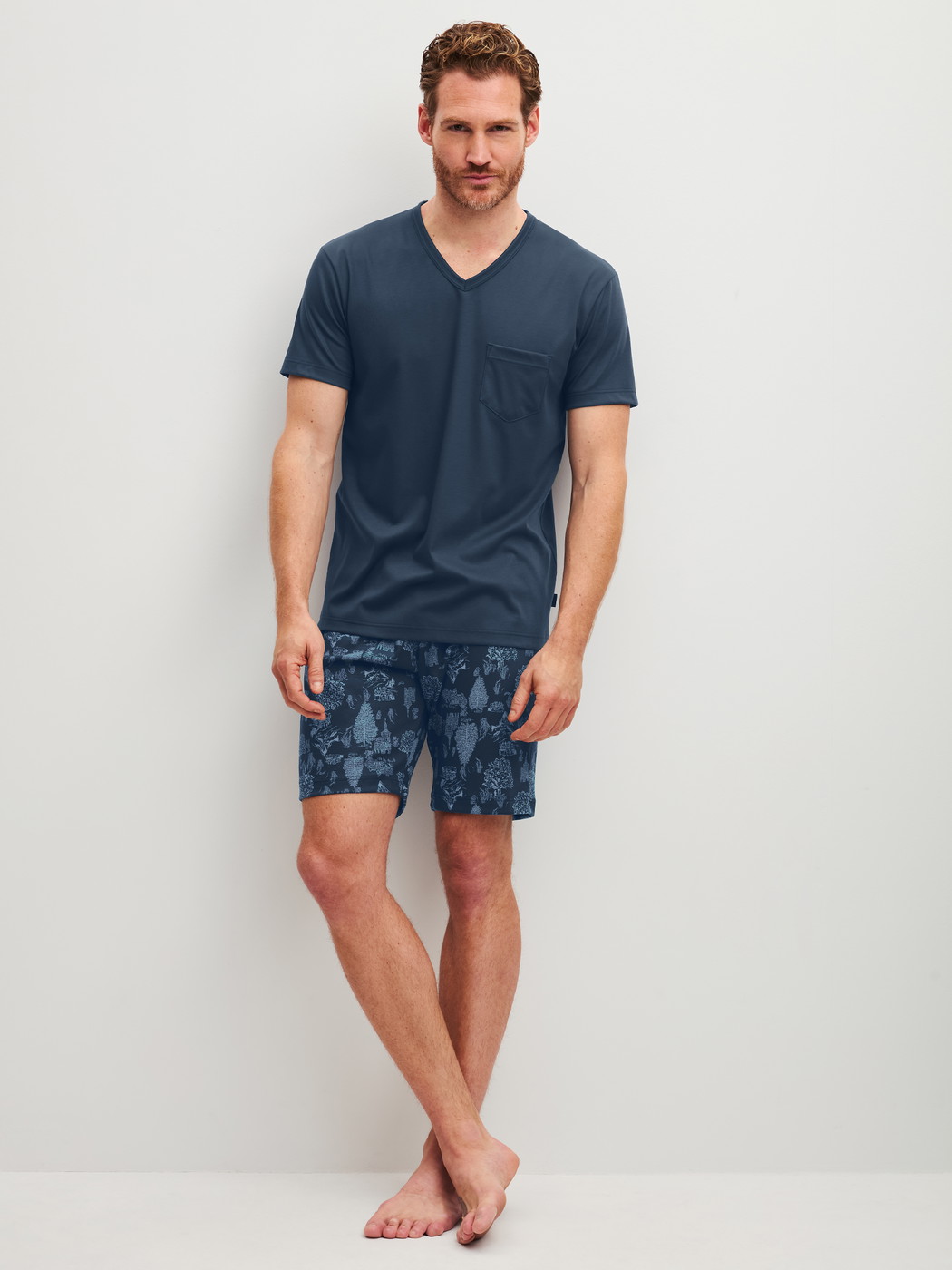 Men model is wearing Short pyjamas made of 100% Cotton in Blue, Patterned from the Relax Streamline 1 series by CALIDA, Front view