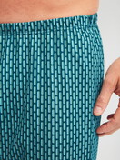 Men model is wearing Short pyjamas made of 100% Cotton in Blue, Patterned from the Relax Streamline 1 series by CALIDA, Detail