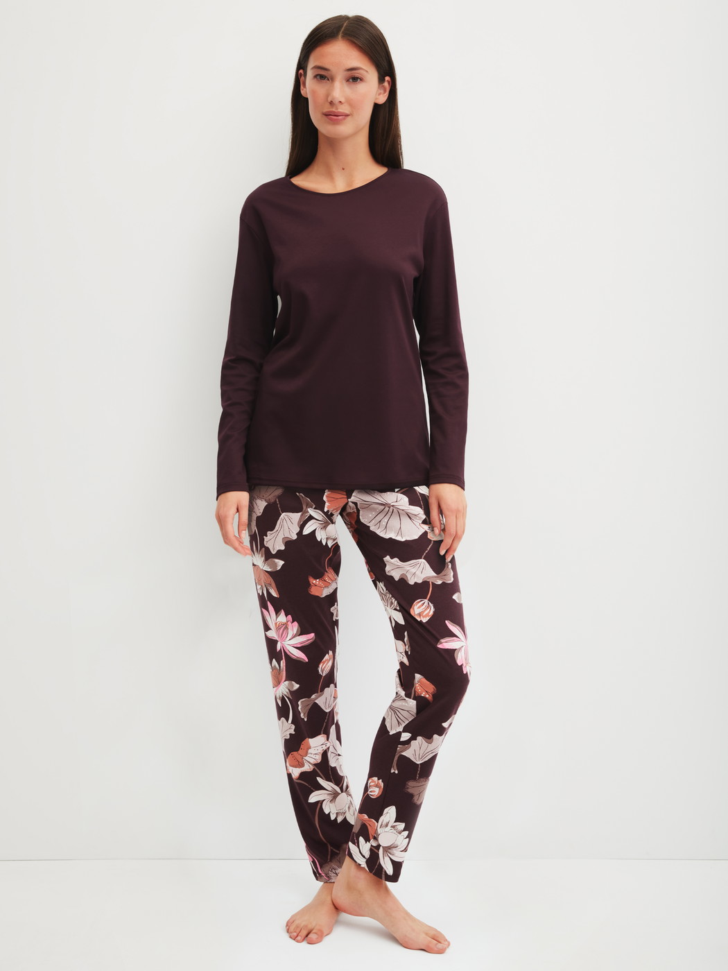 Women model is wearing Pyjamas, long made of 100% Cotton in Red, Floral from the Season Special series by CALIDA, Front view