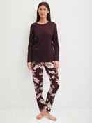 Women model is wearing Pyjamas, long made of 100% Cotton in Red, Floral from the Season Special series by CALIDA, Front view