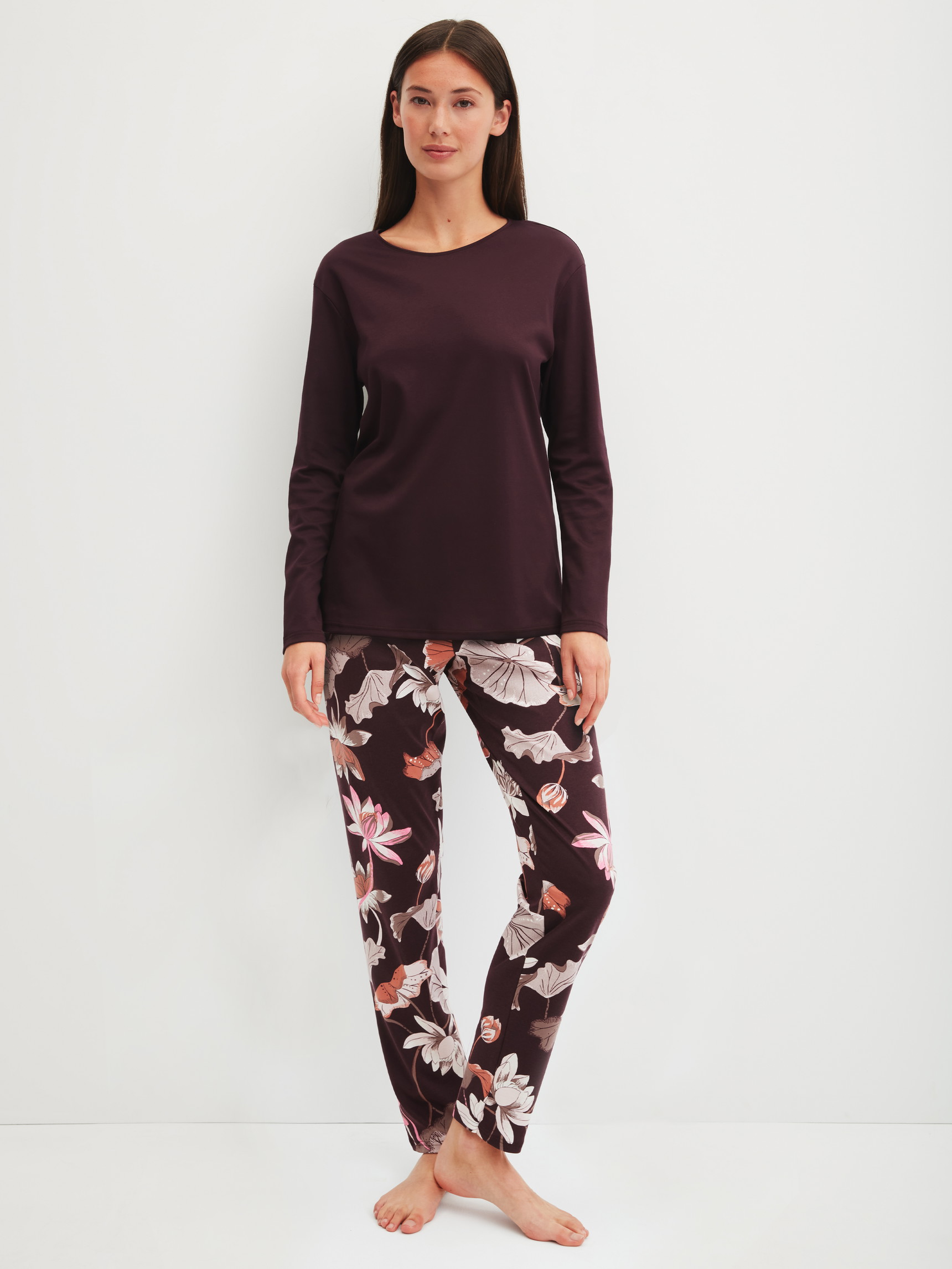 Women model is wearing Pyjamas, long made of 100% Cotton in Red, Floral from the Season Special series by CALIDA, Front view
