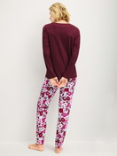 Women model is wearing Pyjamas, long made of 100% Cotton in Red, Patterned from the Season Special series by CALIDA, Back view