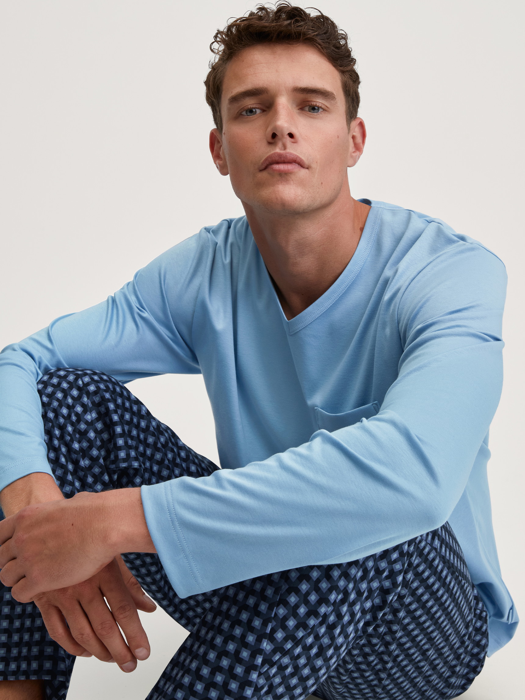 Men model is wearing Pyjamas, long made of 100% Cotton in Blue, Checked from the Relax Streamline 1 series by CALIDA, Front view