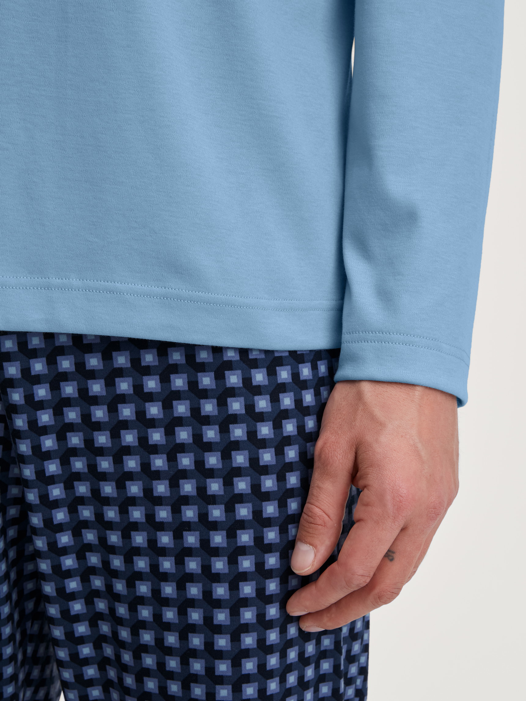 Men model is wearing Pyjamas, long made of 100% Cotton in Blue, Checked from the Relax Streamline 1 series by CALIDA, Detail