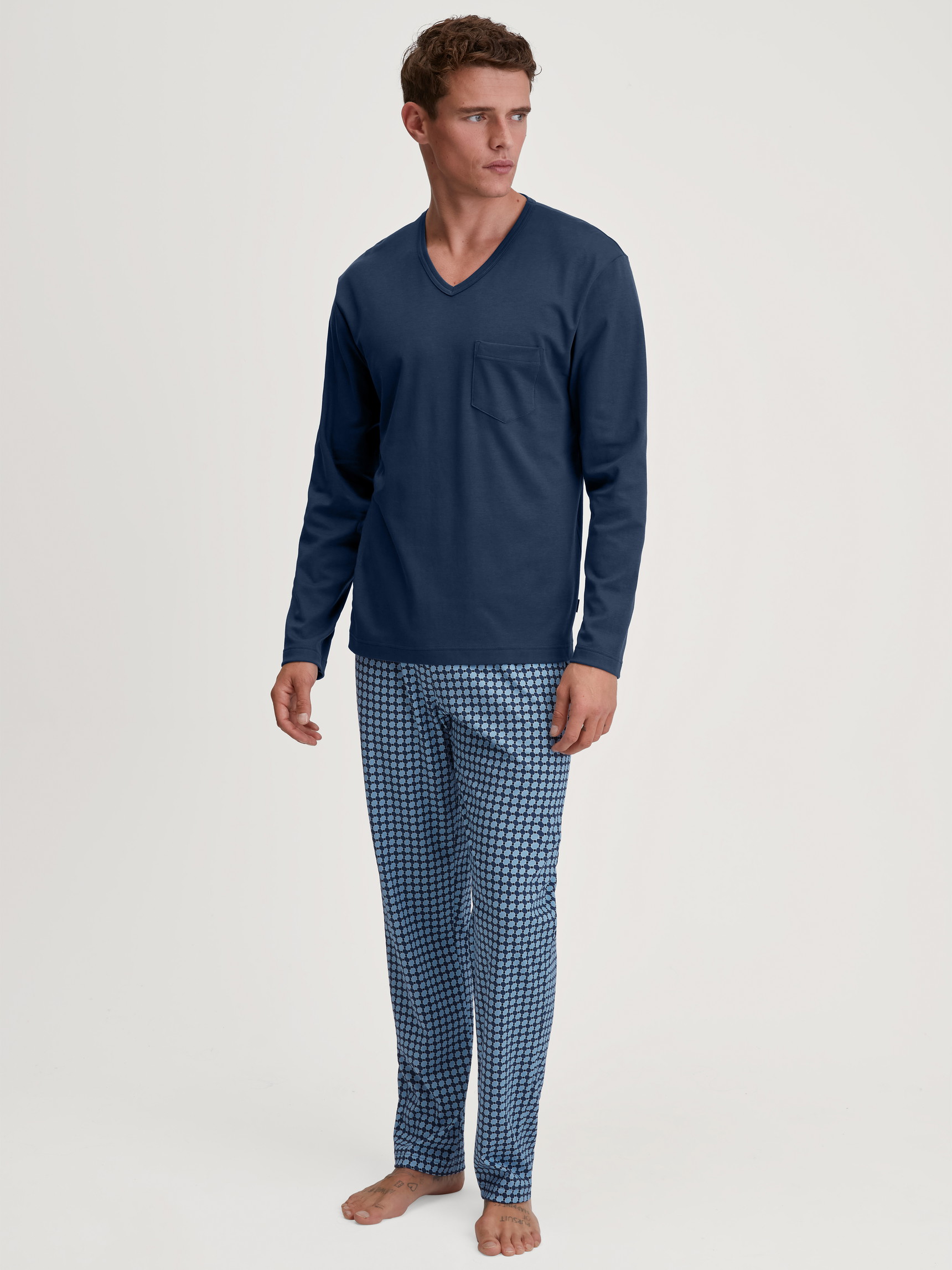 Men model is wearing Pyjamas, long made of 100% Cotton in Blue, Checked from the Relax Streamline 2 series by CALIDA, Front view