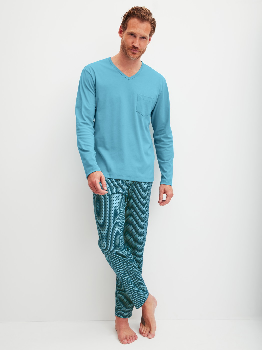 Men model is wearing Pyjamas, long made of 100% Cotton in Blue, Patterned from the Relax Streamline 1 series by CALIDA, Front view
