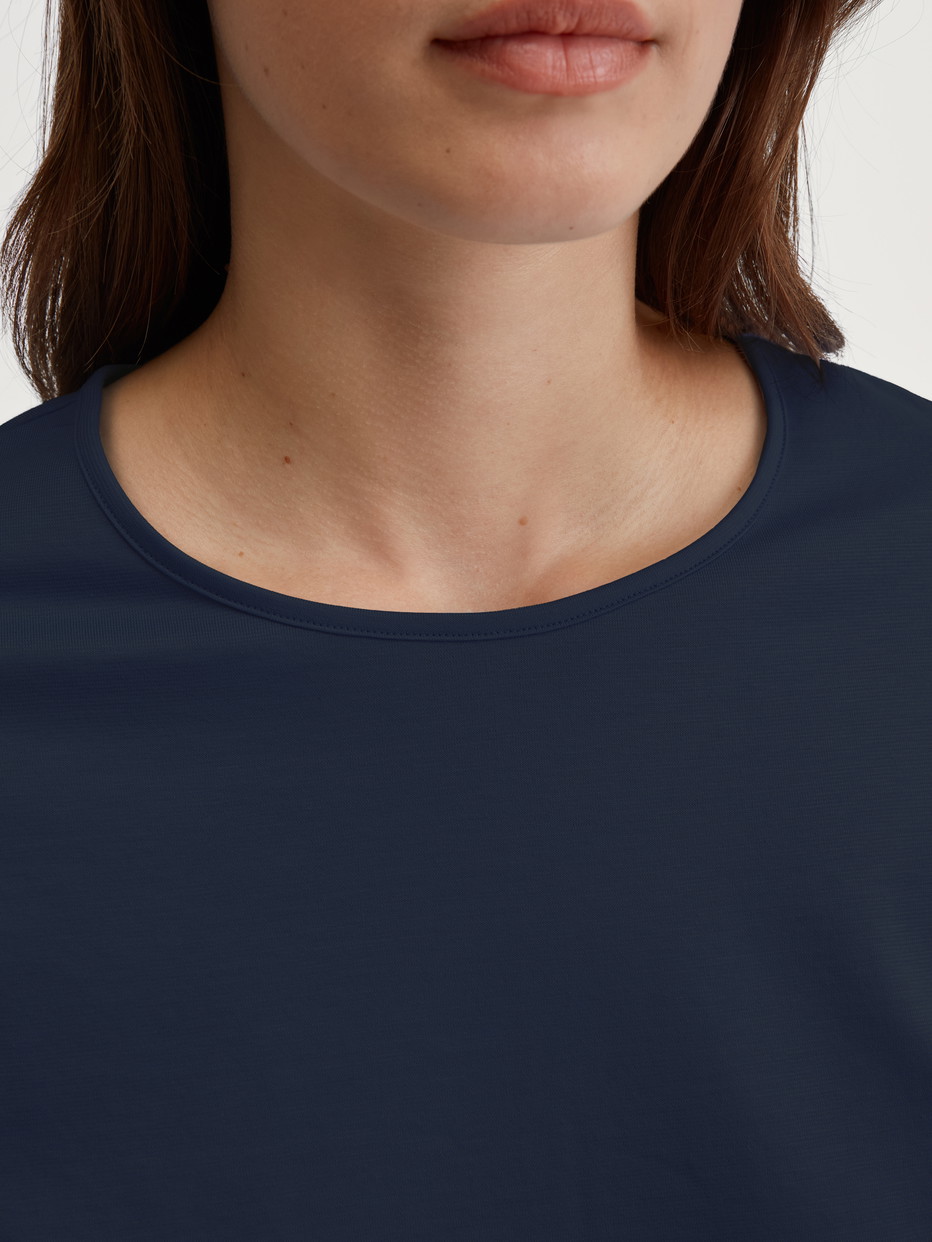 Women model is wearing Pyjamas, long made of 100% Cotton in Blue, Patterned from the Cotton Special series by CALIDA, Detail
