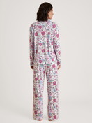Women model is wearing Button-Up Pyjama made of 100% Cotton in Purple, Floral from the Spring Flower Dreams series by CALIDA, Back view