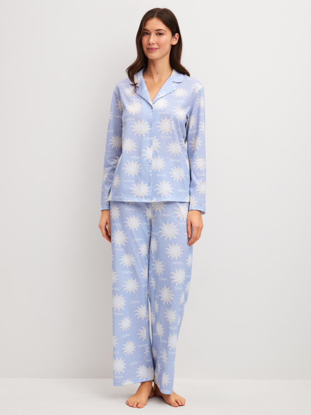 Women model is wearing Button-Up Pyjama made of 100% Cotton in Blue, Patterned from the EDITION 85 series by CALIDA, Front view