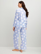 Women model is wearing Button-Up Pyjama made of 100% Cotton in Blue, Patterned from the EDITION 85 series by CALIDA, Back view