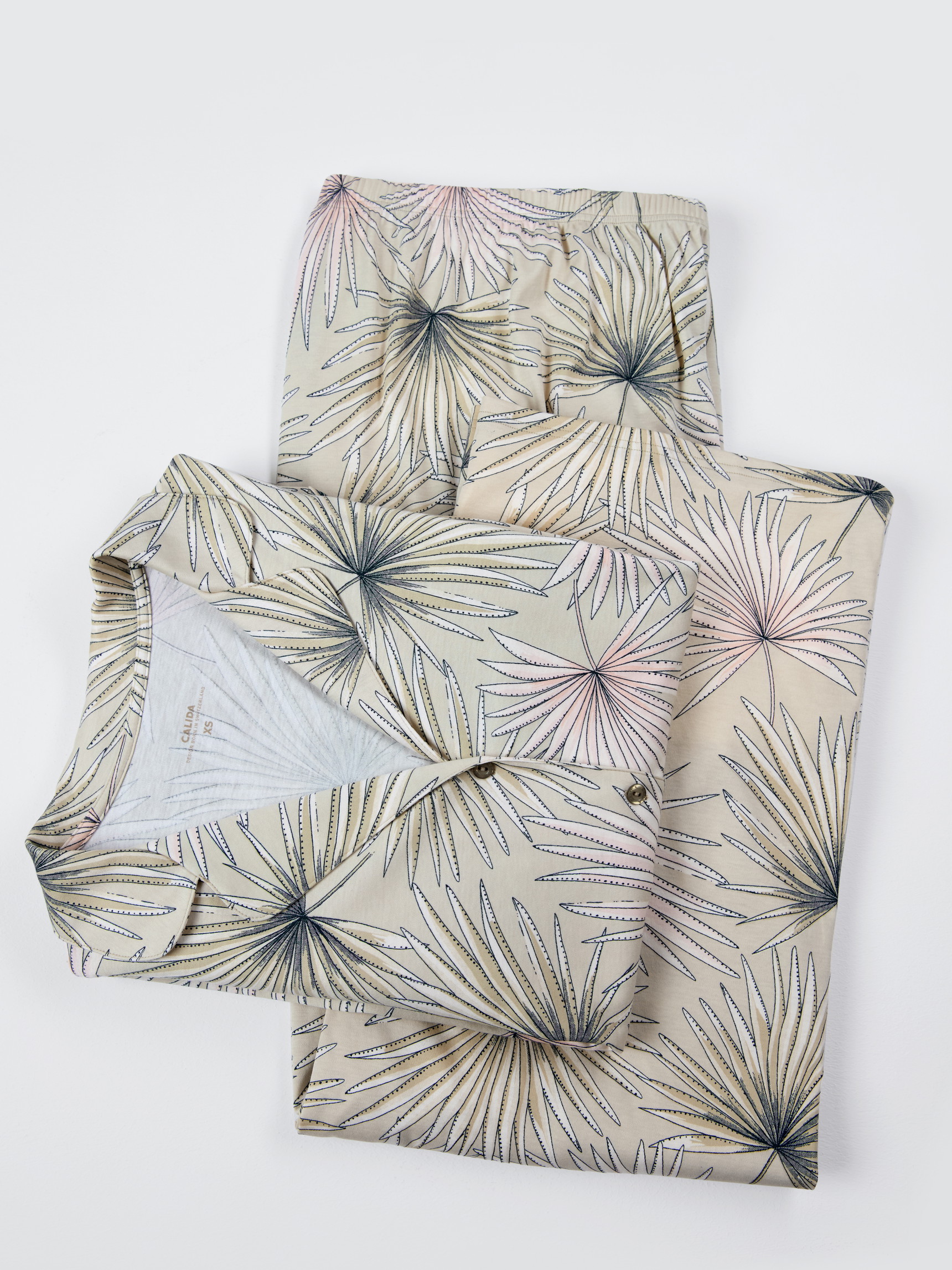 Women model is wearing Button-Up Pyjama made of 100% Cotton in Green, Floral from the Leaf Dreams series by CALIDA, Additional Image