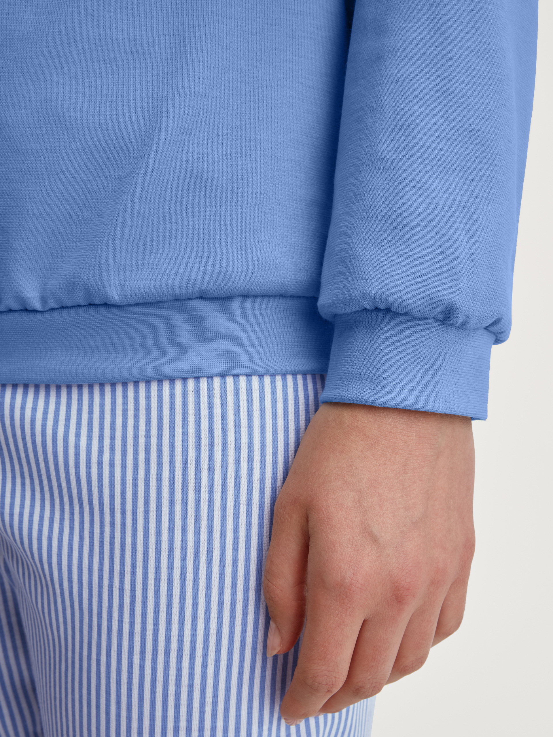 Women model is wearing Pyjama with cuff made of 100% Cotton in Blue, Patterned from the Lovely Nights series by CALIDA, Detail