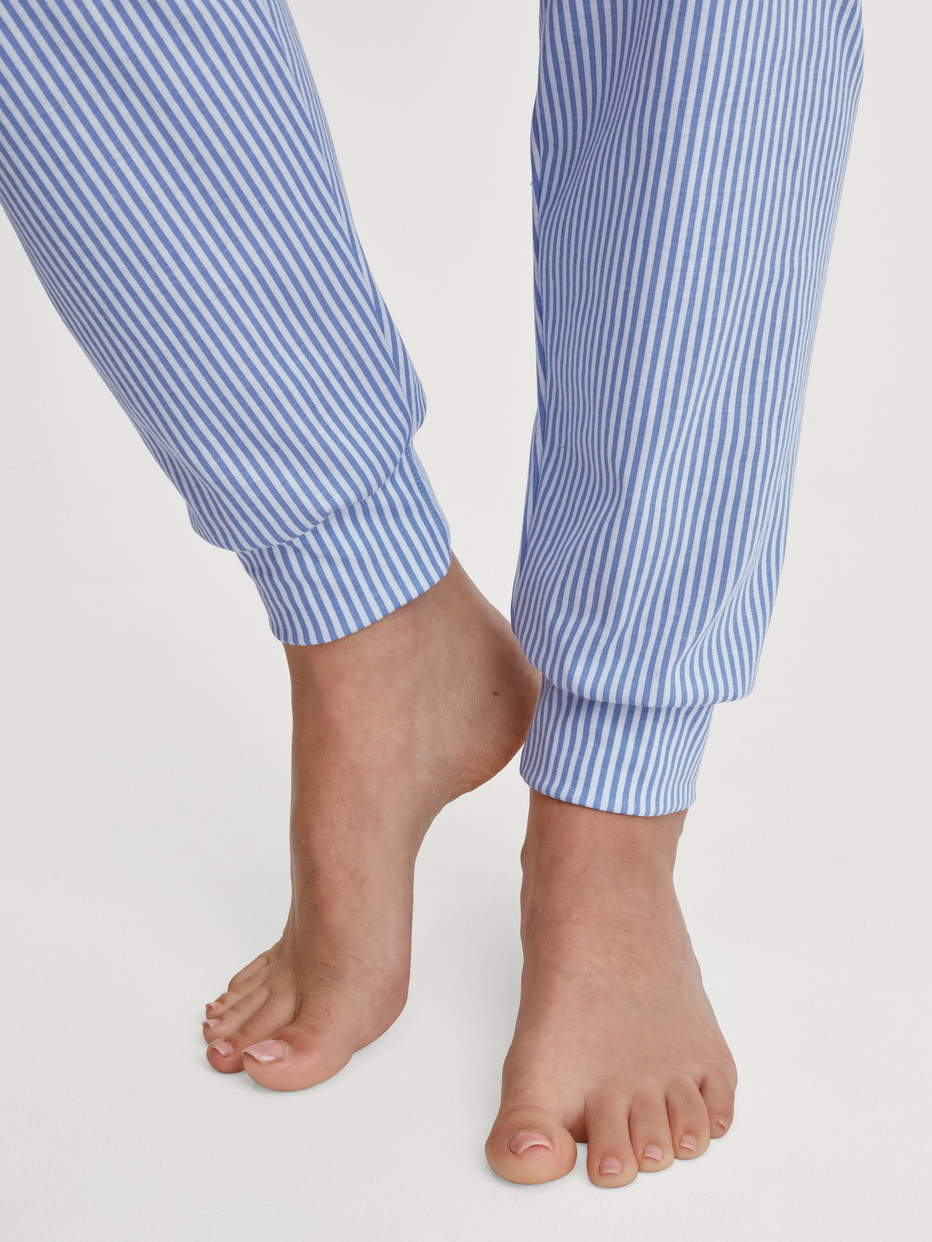 Women model is wearing Pyjama with cuff made of 100% Cotton in Blue, Patterned from the Lovely Nights series by CALIDA, Detail