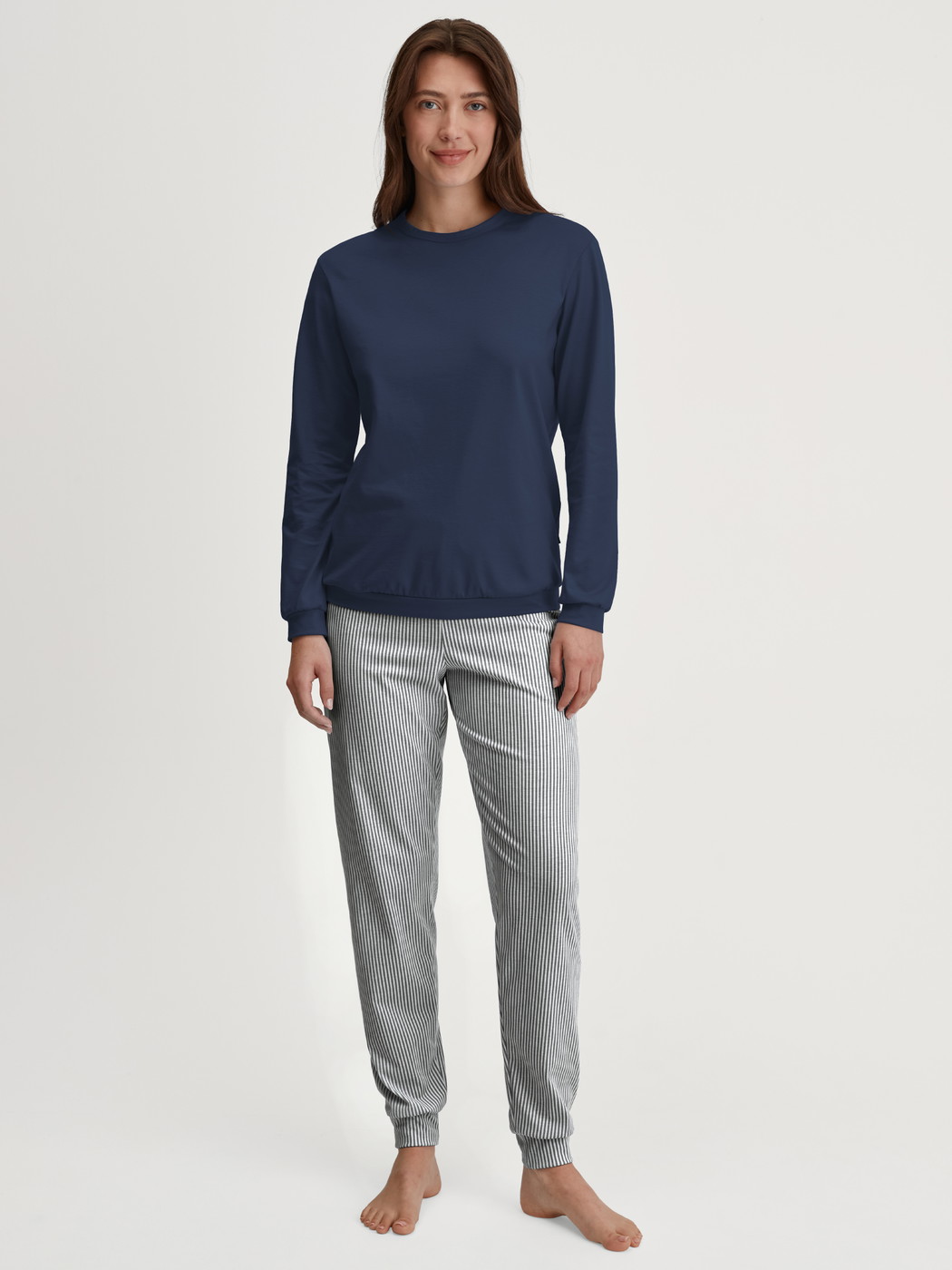 Women model is wearing Pyjama with cuff made of 100% Cotton in Blue, Patterned from the Cotton Special series by CALIDA, Front view