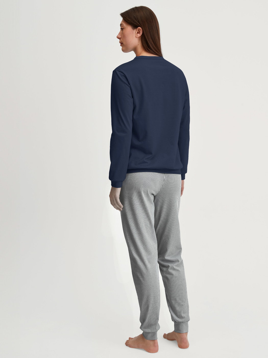 Women model is wearing Pyjama with cuff made of 100% Cotton in Blue, Patterned from the Cotton Special series by CALIDA, Back view