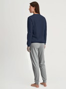 Women model is wearing Pyjama with cuff made of 100% Cotton in Blue, Patterned from the Cotton Special series by CALIDA, Back view