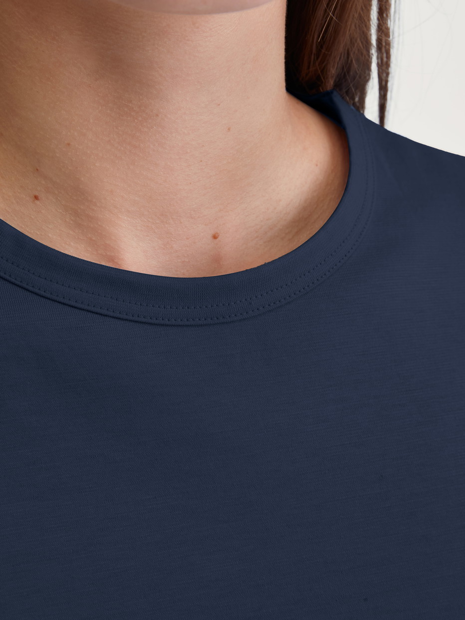 Women model is wearing Pyjama with cuff made of 100% Cotton in Blue, Patterned from the Cotton Special series by CALIDA, Detail
