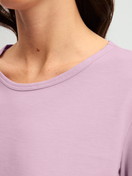 Women model is wearing Pyjamas, long made of 100% Cotton in Purple, Patterned from the Blooming Nights series by CALIDA, Detail