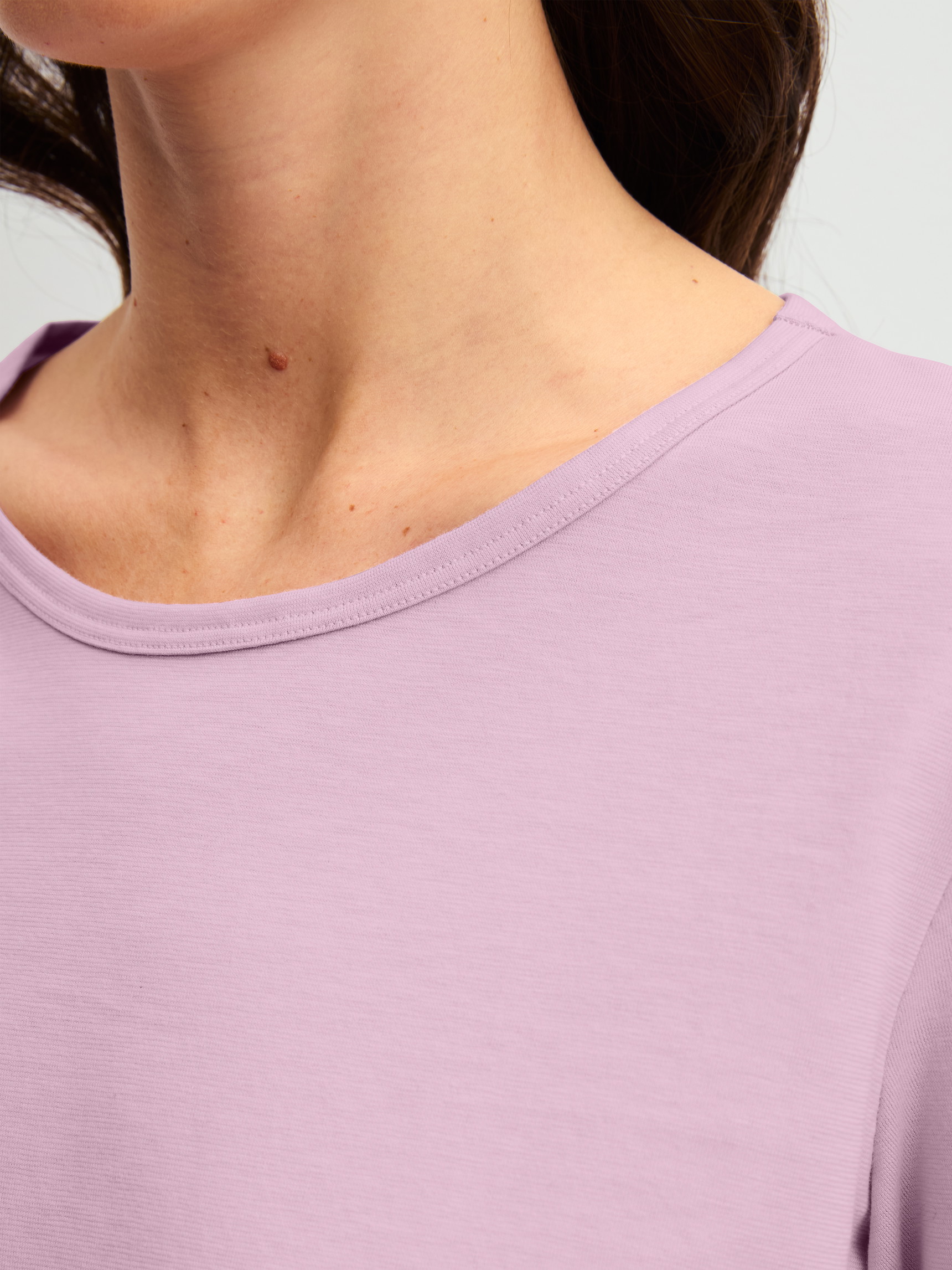Women model is wearing Pyjamas, long made of 100% Cotton in Purple, Patterned from the Blooming Nights series by CALIDA, Detail