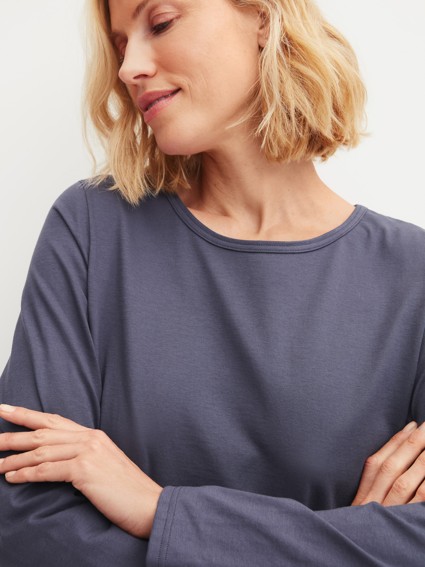 Women model is wearing Pyjamas, long made of 100% Cotton in Blue, Patterned from the Graphic Nights series by CALIDA, Detail